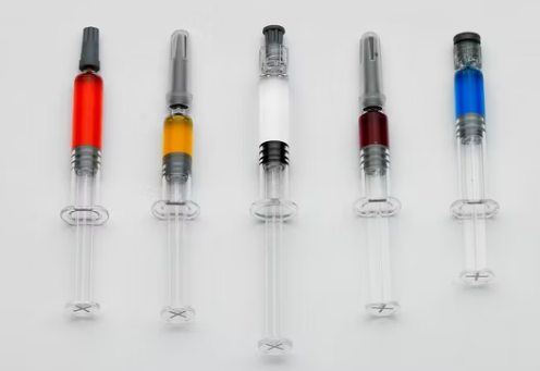 Aseptic pre-filled syringe filling and sealing line